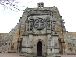 Look for all the little details. The Masonic Compass, the Templar Rose, Fleur de lis, the Templar Cross; they're all in the carvings above the door. 