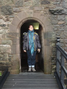 Nat is 5'4, standing in the doorway to St Margaret's Chapel