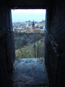 Peeking through the Castle walls over the city below